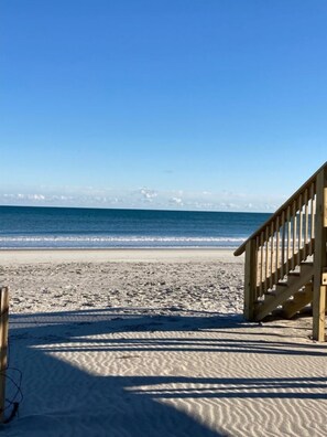 On the beach, sun-loungers