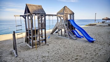 Enjoy ocean views from the beachside play structure with a ladder and platform.