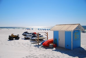 On the beach, sun-loungers