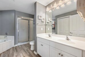 Bathtub, hair dryer, towels, soap