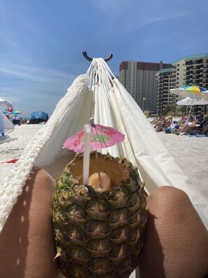 On the beach, sun-loungers