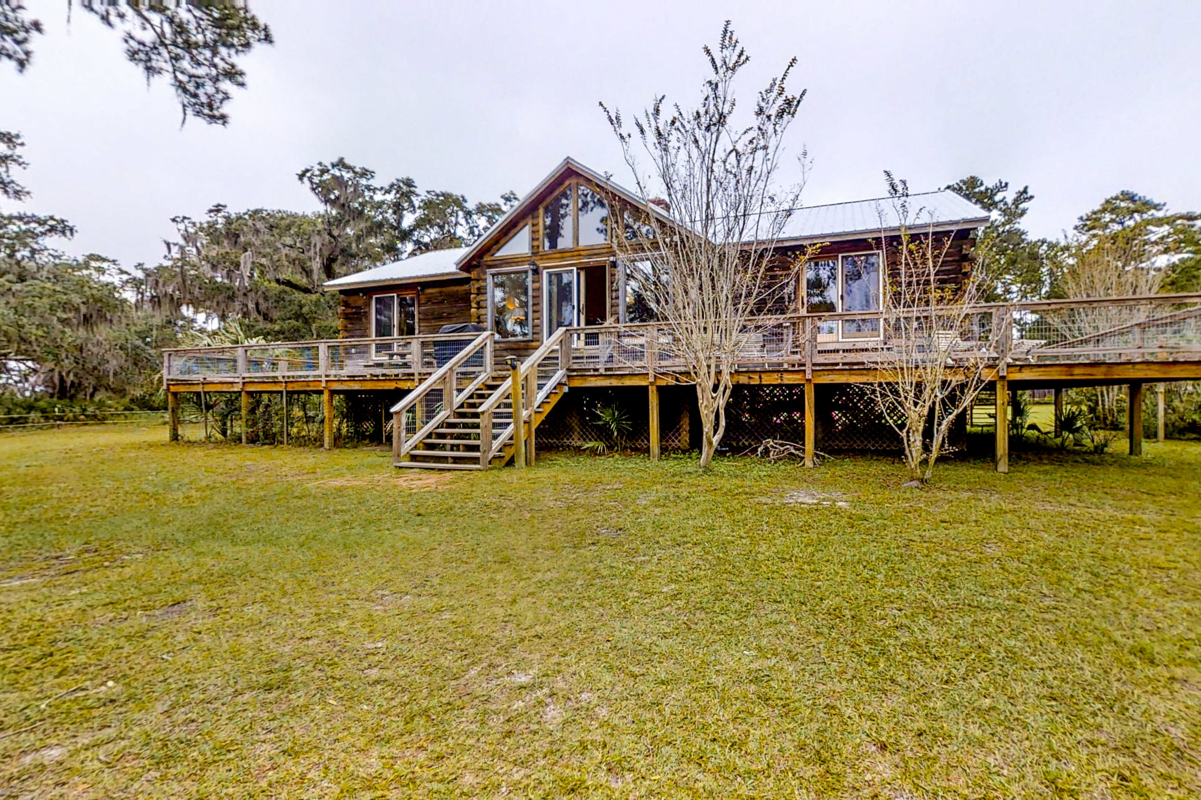 Stunning and remote riverfront home with private dock & gas grill