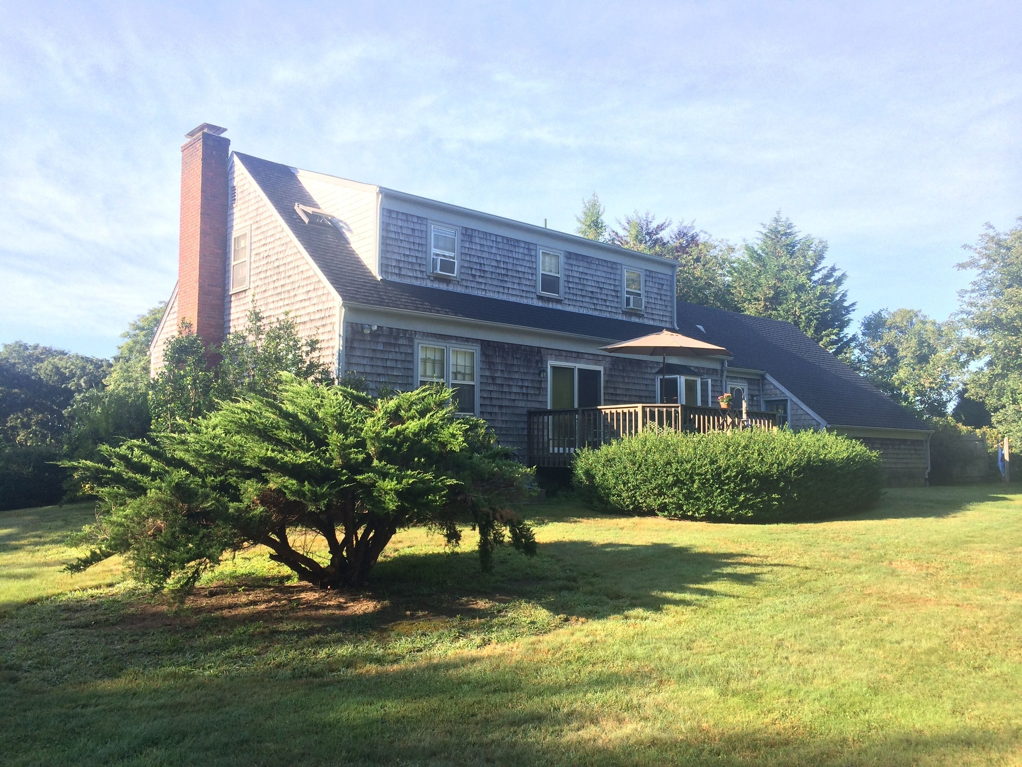 Country home in lovely Little Compton: stone walls, fields, woods, sky, beach