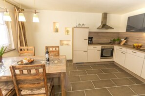 Luxury Condo (Kolonial) | Private kitchen | Full-size fridge, microwave, stovetop, dishwasher