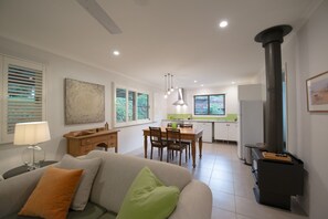 Flat-screen TV, fireplace, DVD player, books