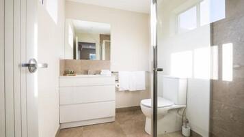 Shower, rainfall showerhead, hair dryer, towels