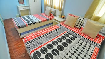 Desk, iron/ironing board, bed sheets