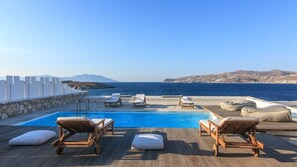 Seasonal outdoor pool, pool loungers