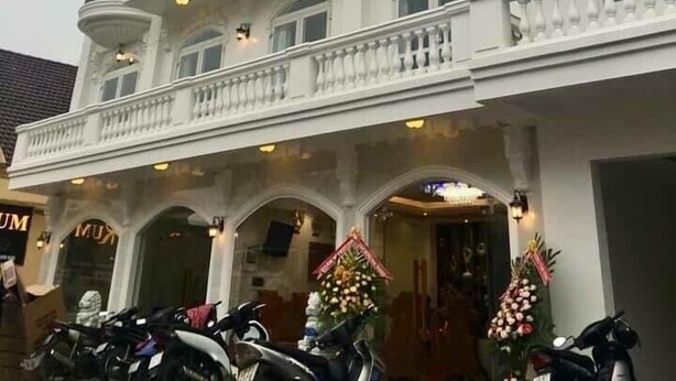 A multi-story building with ornate architectural details, including balconies and decorative moldings. - Golden Rum Hotel (Xuan Huong - Da Lat)