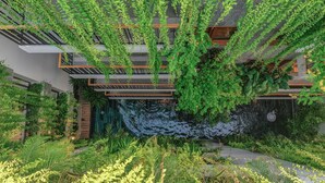 A modern building with a rooftop garden, a water feature, and lush greenery. - Ponte Boutique Villa (Da Nang)