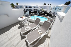 Junior Suite, Pool View | 1 bedroom, free minibar items, in-room safe, desk