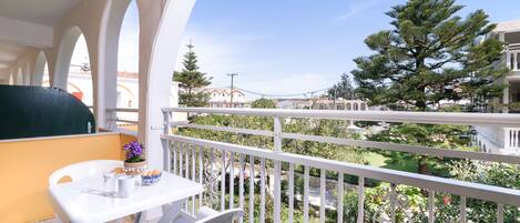 Triple Room, Garden View | Balcony view