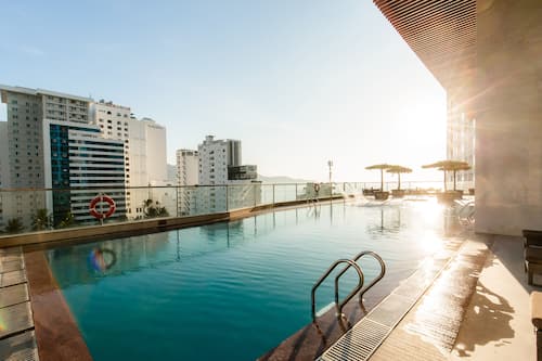 Outdoor pool, open 6:00 AM to 9:00 PM, pool loungers