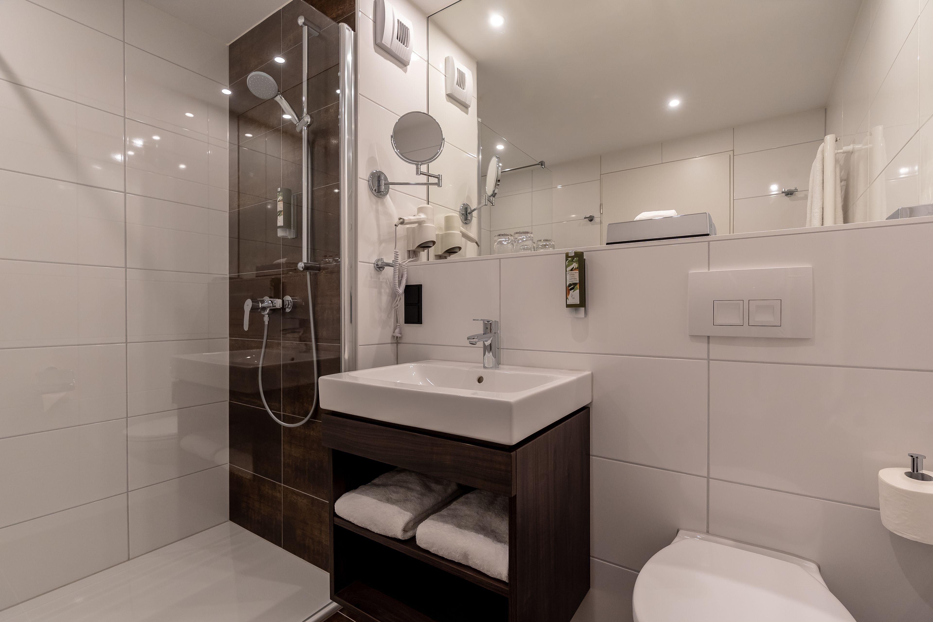 shower, free toiletries, hair dryer, towels