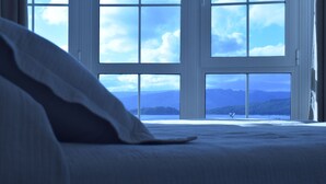 A bedroom with a large window offering a view of mountains and a body of water. - Pensión O Noso (Porto do Son)