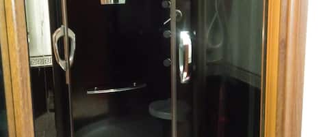 Shower, hair dryer, towels, shampoo