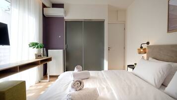 Deluxe appartement, 3 slaapkamers, balkon | Luxe beddengoed, pillowtop-bedden, een kluis op de kamer