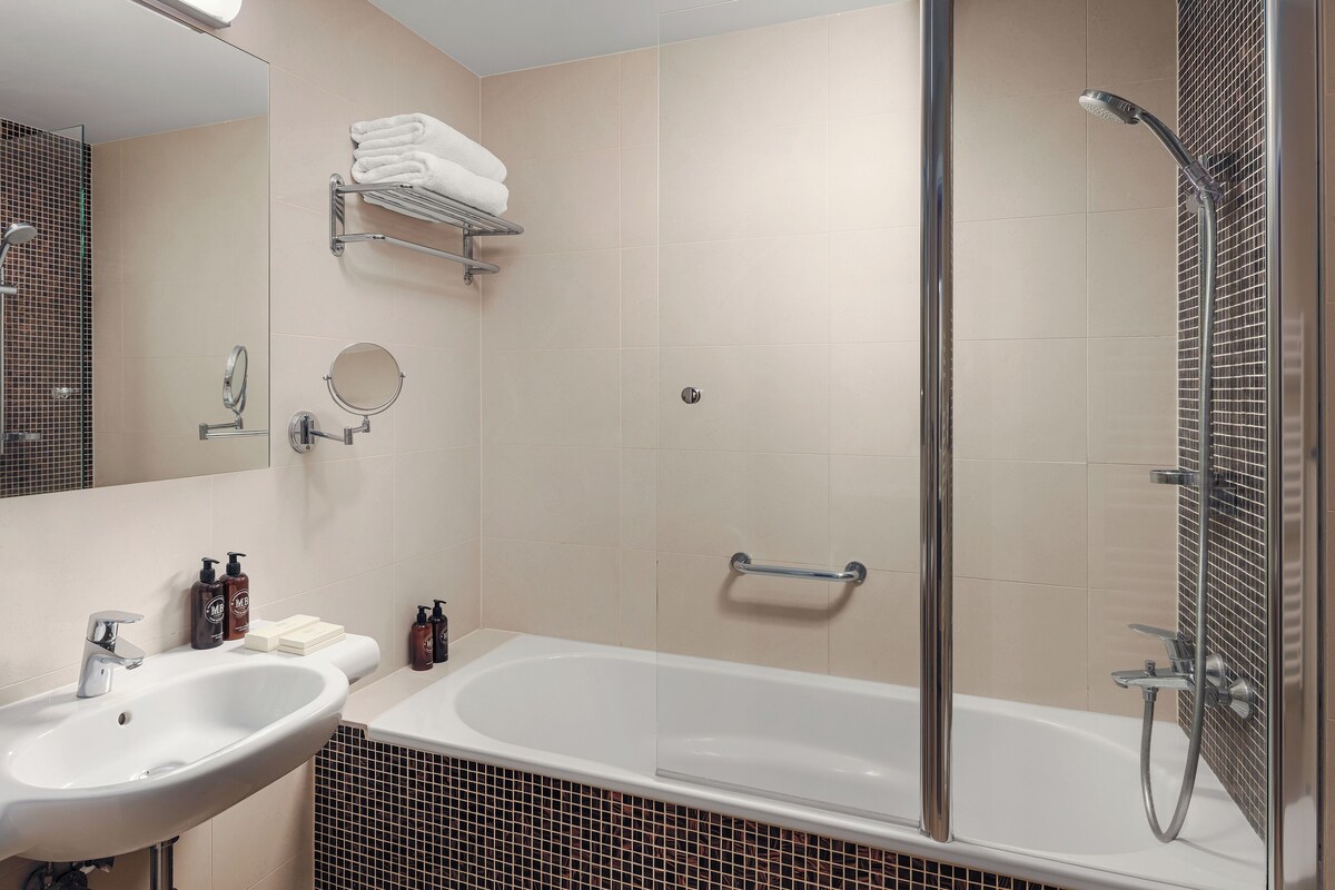 Bathroom | Designer toiletries, hair dryer, bathrobes, slippers