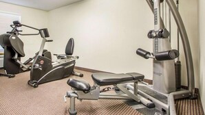 A gym with cardio machines, weight training equipment, and a bench. - Surestay Best Western Obetz Rickenbacker Airport (Columbus)