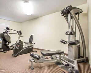 A gym with cardio machines, weight training equipment, and a bench. - Surestay Best Western Obetz Rickenbacker Airport (Columbus)