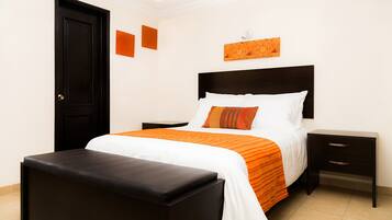 A neatly arranged bedroom with a bed, a nightstand, and a bench.
