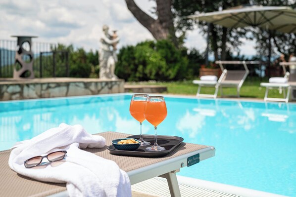 Seasonal outdoor pool, open 9:30 AM to 8:00 PM, sun loungers