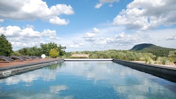 Outdoor pool, open 9:00 AM to 8:00 PM, pool umbrellas, pool loungers