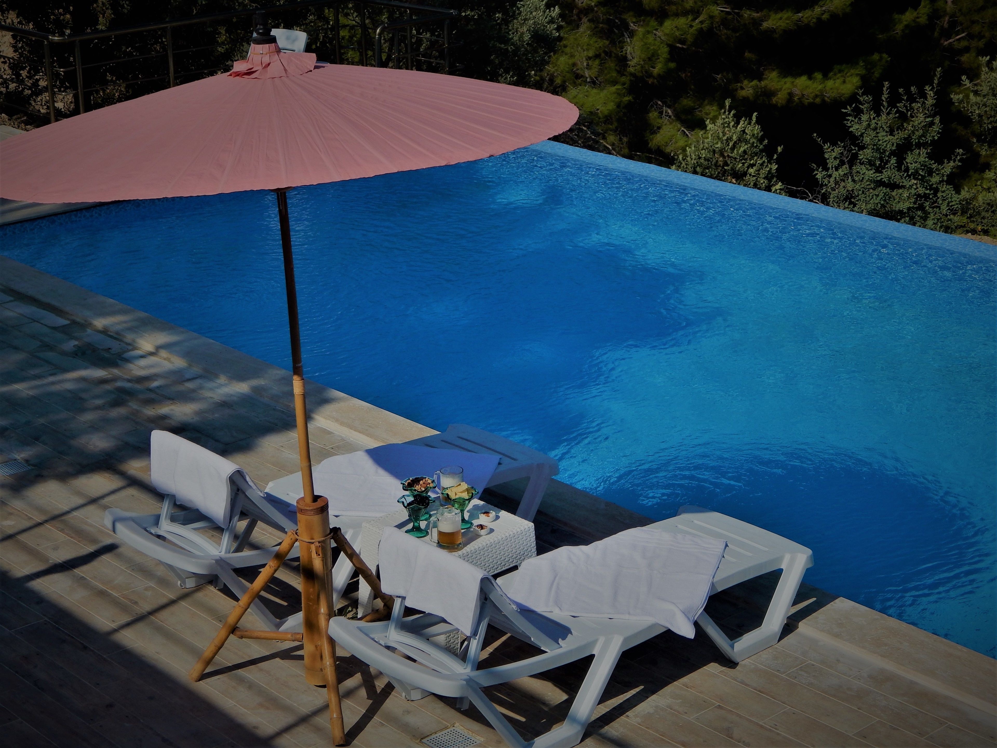 seasonal outdoor pool, open 9:00 am to 11:30 pm, pool umbrellas