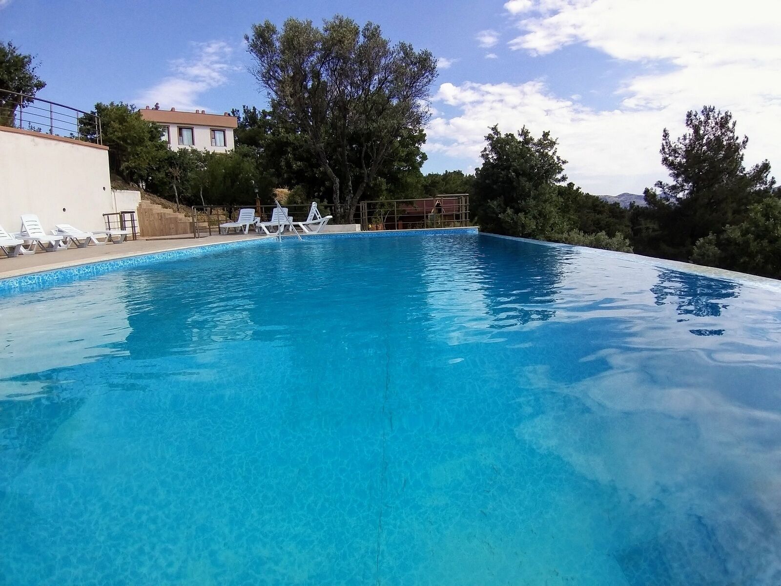 seasonal outdoor pool, open 9:00 am to 11:30 pm, pool umbrellas