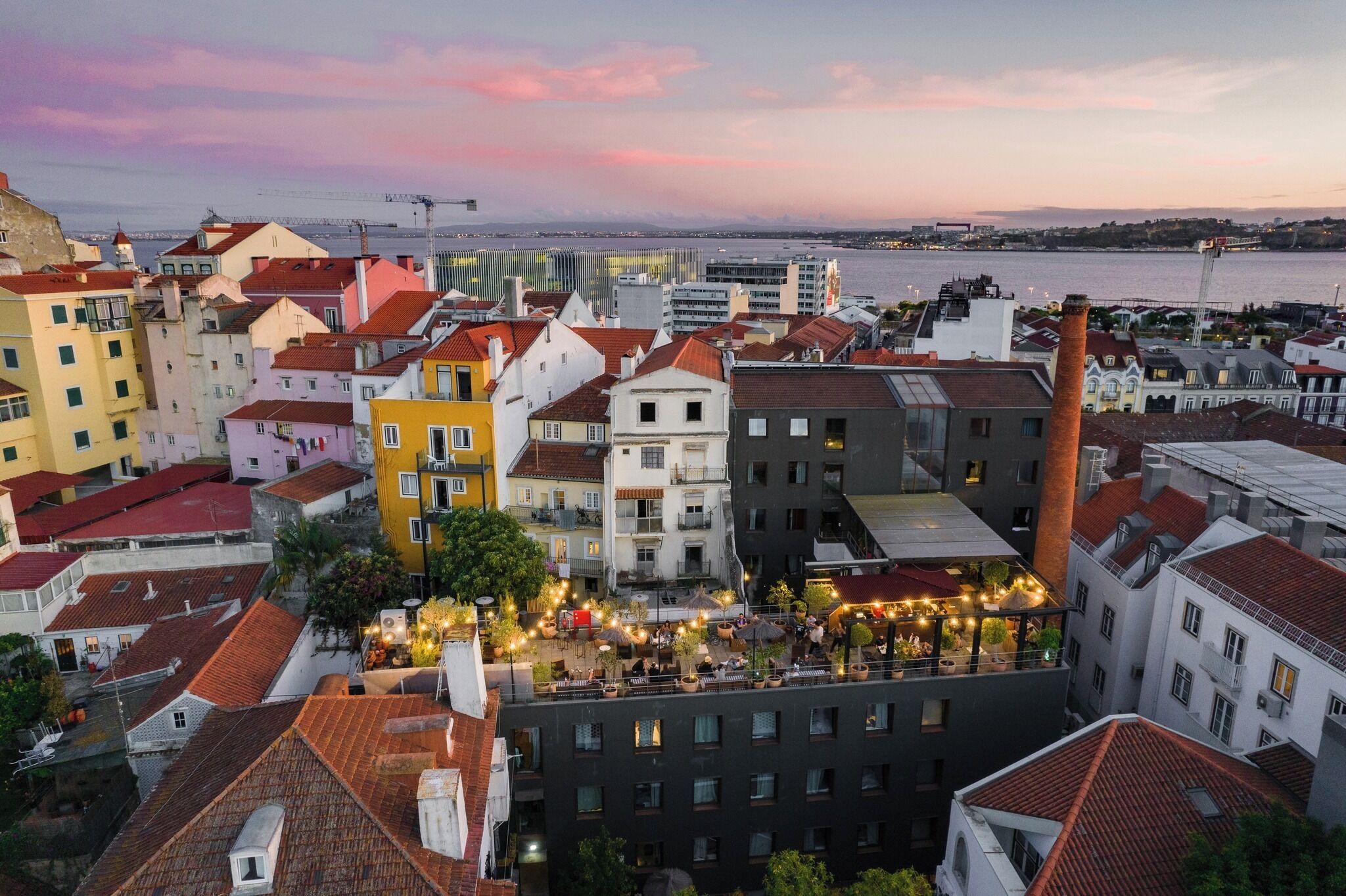 A cityscape with a variety of building styles, including a prominent tower and a waterfront view.
