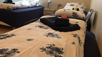 Triple Room, Shared Bathroom | Blackout drapes, free cribs/infant beds, free WiFi, bed sheets