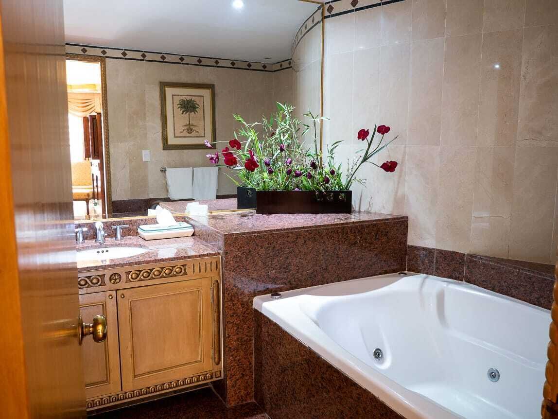 luxury suite, multiple beds, non smoking | bathroom | shower, free toiletries, hair dryer, towels