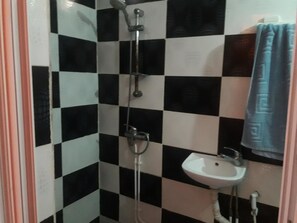 Suite, Non Smoking, City View | Bathroom | Shower, rainfall showerhead, free toiletries