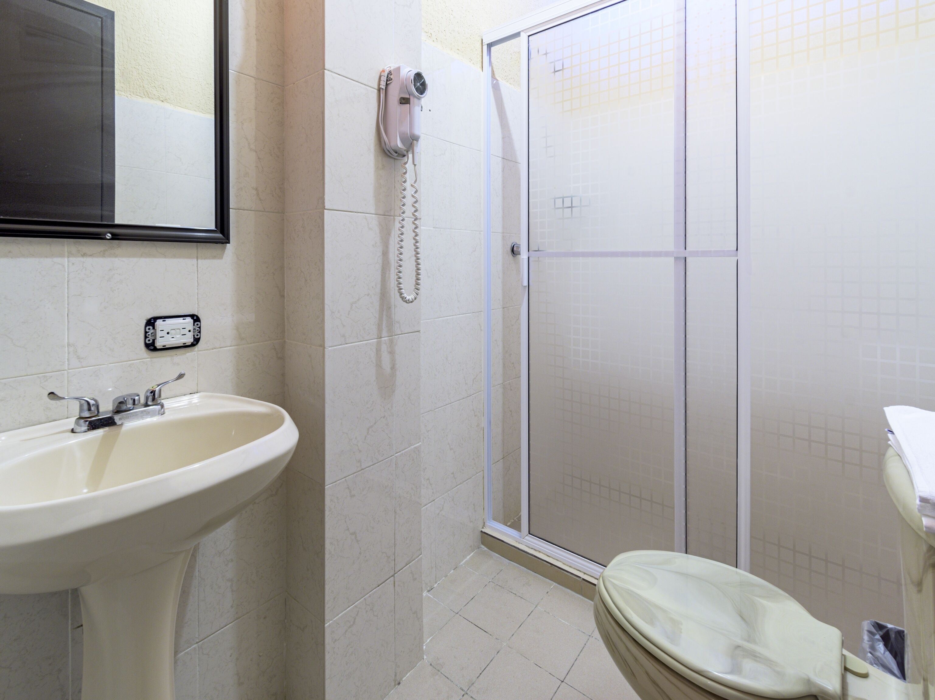 standard quadruple room | bathroom | hair dryer, towels, soap, shampoo