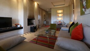 Apartment, 2 Bedrooms, Non Smoking | Living area | Plasma TV, fireplace - Golf City Av Med IV (Marrakech)