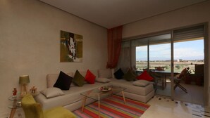 Apartment, 2 Bedrooms, Non Smoking | Living area | Plasma TV, fireplace - Golf City Av Med IV (Marrakech)