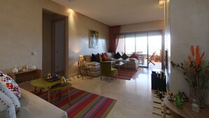 Apartment, 2 Bedrooms, Non Smoking | Living area | Plasma TV, fireplace - Golf City Av Med IV (Marrakech)