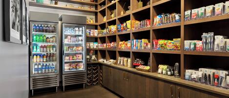 A well-organized pantry with shelves stocked with various food items and beverages.