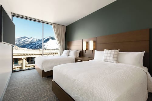 Hypo-allergenic bedding, desk, laptop workspace, blackout curtains