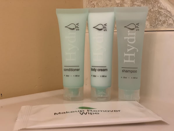 Three Hydra Spa products: conditioner, body cream, and shampoo, along with a pack of makeup remover wipes. - "The Richard" 3BR Lakefront: 60-Ac Estate Access with Private Beach sleeps 8 (Irving)