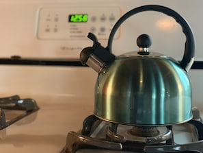 A stainless steel kettle on a portable gas stove. - "The Richard" 3BR Lakefront: 60-Ac Estate Access with Private Beach sleeps 8 (Irving)