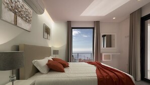 A modern hotel room with a large bed, a nightstand, a lamp, and a view of the city through a large window. - Villa Guinea - Fantastic House With Spectacular Views And Pool  (Funchal- Madeira)