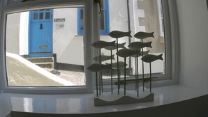 A window with a decorative fish sculpture. -  Peaceful with Patio in Downalong, Moments from Beaches, Harbour, Town, Parking (St Ives)