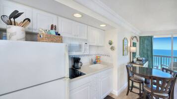 Fridge, microwave, stovetop, coffee/tea maker