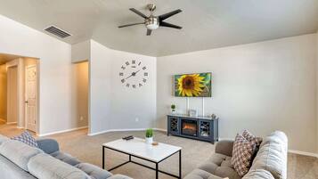 TV, fireplace, books, offices