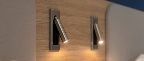 A modern wall with two recessed lighting fixtures.