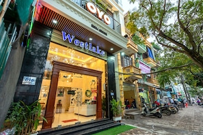 A hotel with a prominent 'Westlake' sign, a reception desk, and a visible entrance. - Westlake Tay Ho Hotel (Hanoi)
