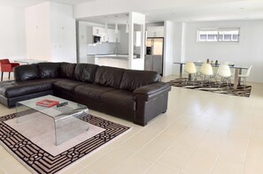 Exclusive House, Multiple Beds, Accessible, Canal View | Living area | Flat-screen TV - The Promenade on Capri (Surfers Paradise)