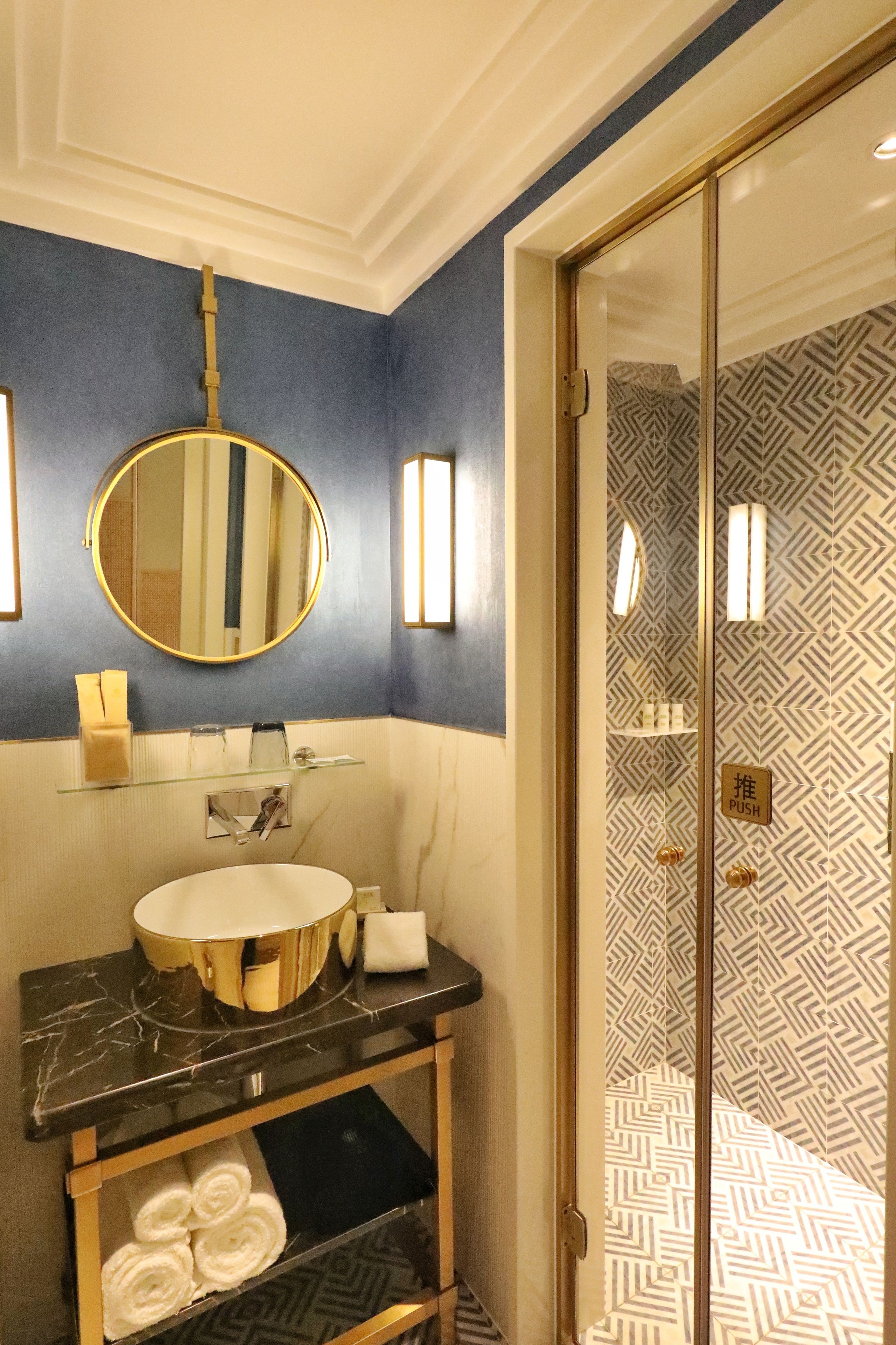 shower, hair dryer, slippers, towels