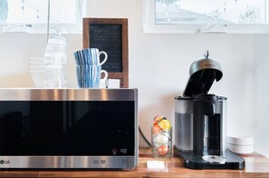 Fridge, microwave, coffee/tea maker, cookware/dishes/utensils